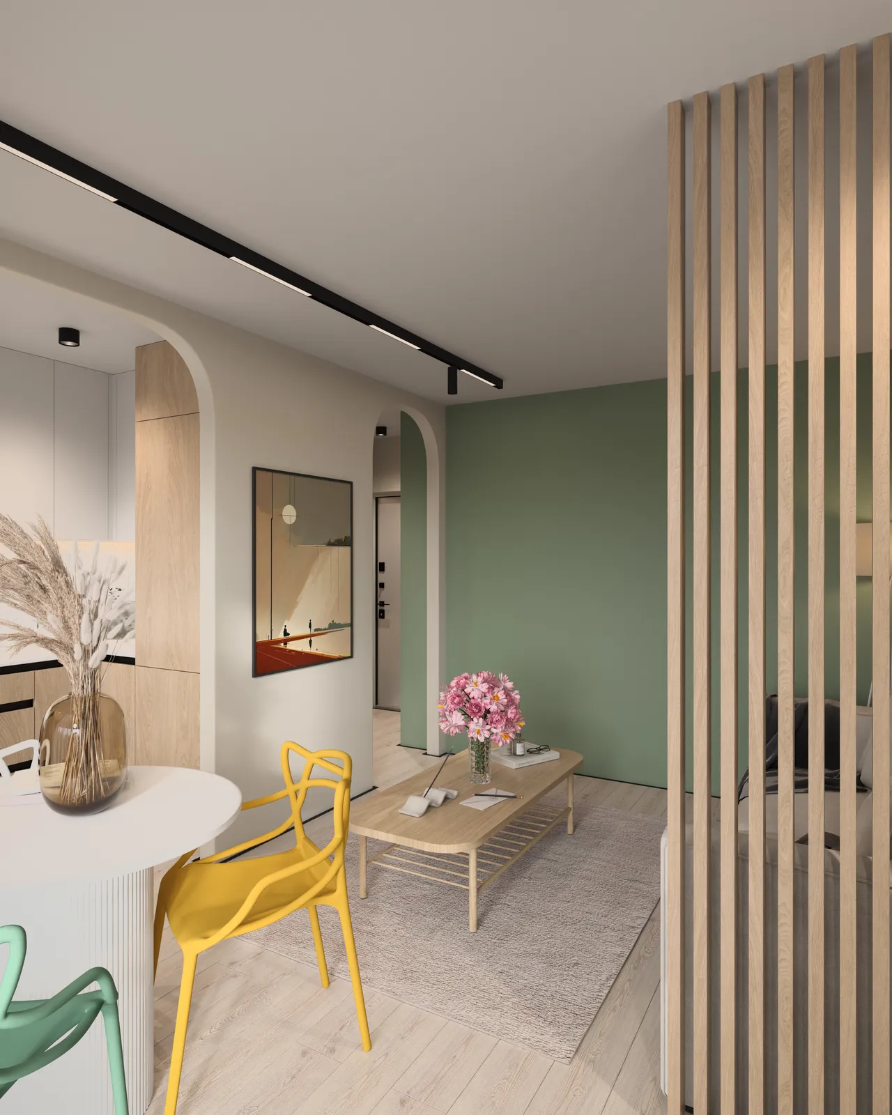 A modern interior space featuring a dining area with colorful chairs, a coffee table on a light rug, and an accent wall in green. There are decorative items like flowers on the table and artwork on the walls, creating an inviting atmosphere.