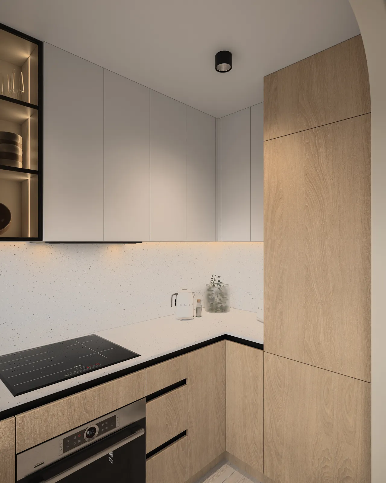 A modern kitchen featuring light wood cabinetry, black countertops, and minimalistic design elements.
