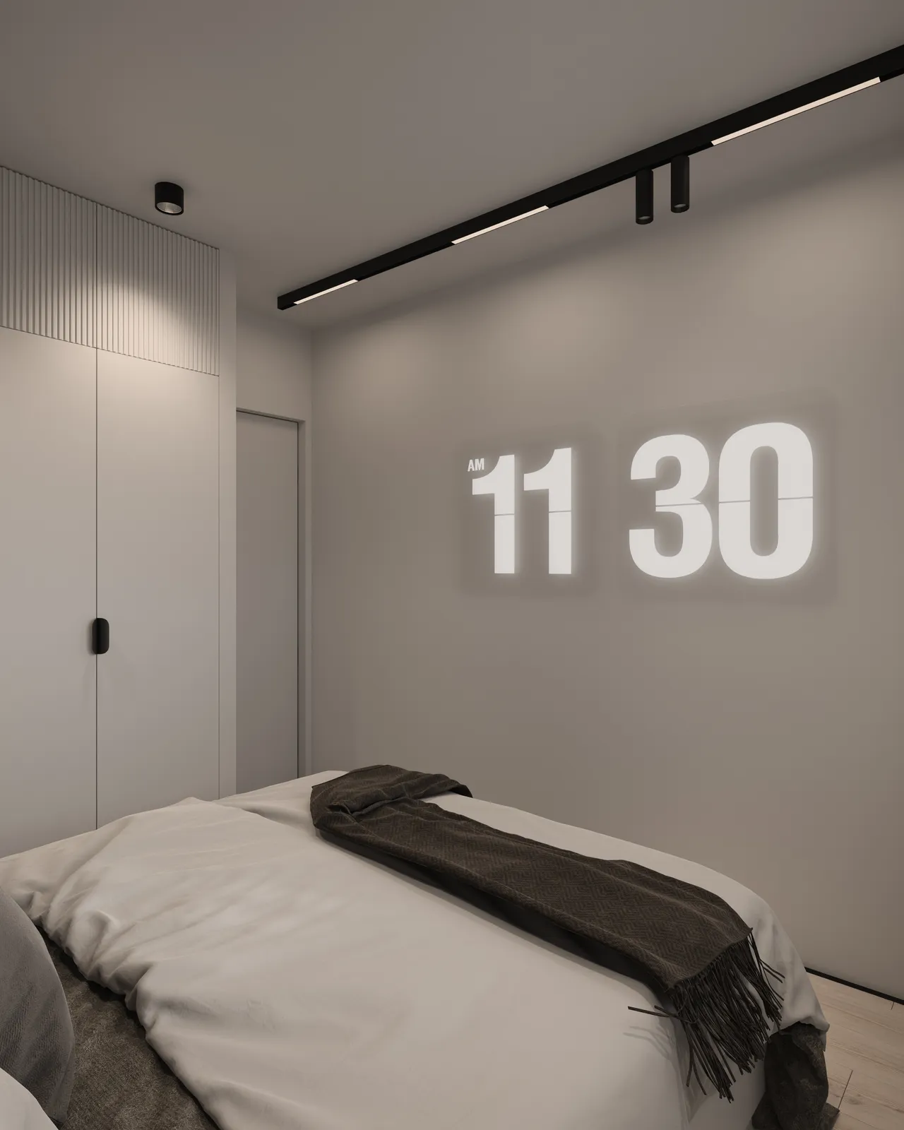A modern bedroom with a minimalist design, featuring a bed with gray bedding and a wall that displays the time 11:30. The room has recessed lighting and simple decor.