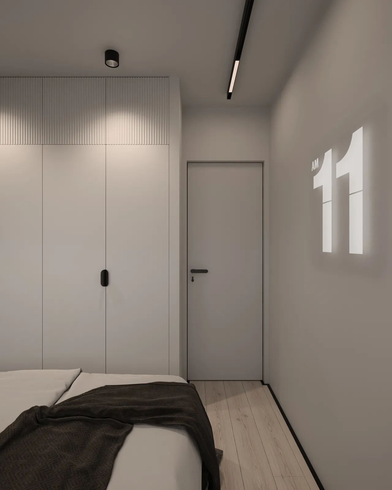 A modern bedroom with a minimalistic design, featuring a wall-mounted clock displaying the time 11 AM, a bed with gray bedding, and light-colored walls and flooring. A closed door is visible in the background.