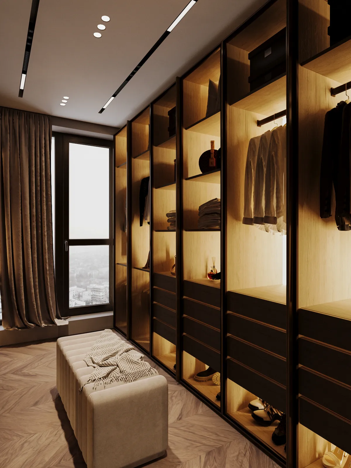A luxurious walk-in closet with warm lighting, featuring neatly arranged clothes, shelves with accessories, a large window, and a cushioned bench on herringbone wood floor.