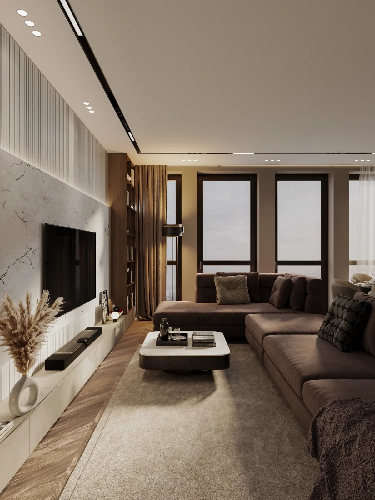 Modern, dimly lit living room featuring a large brown sectional sofa, a floating white and dark coffee table, and a mounted television against a textured accent wall.