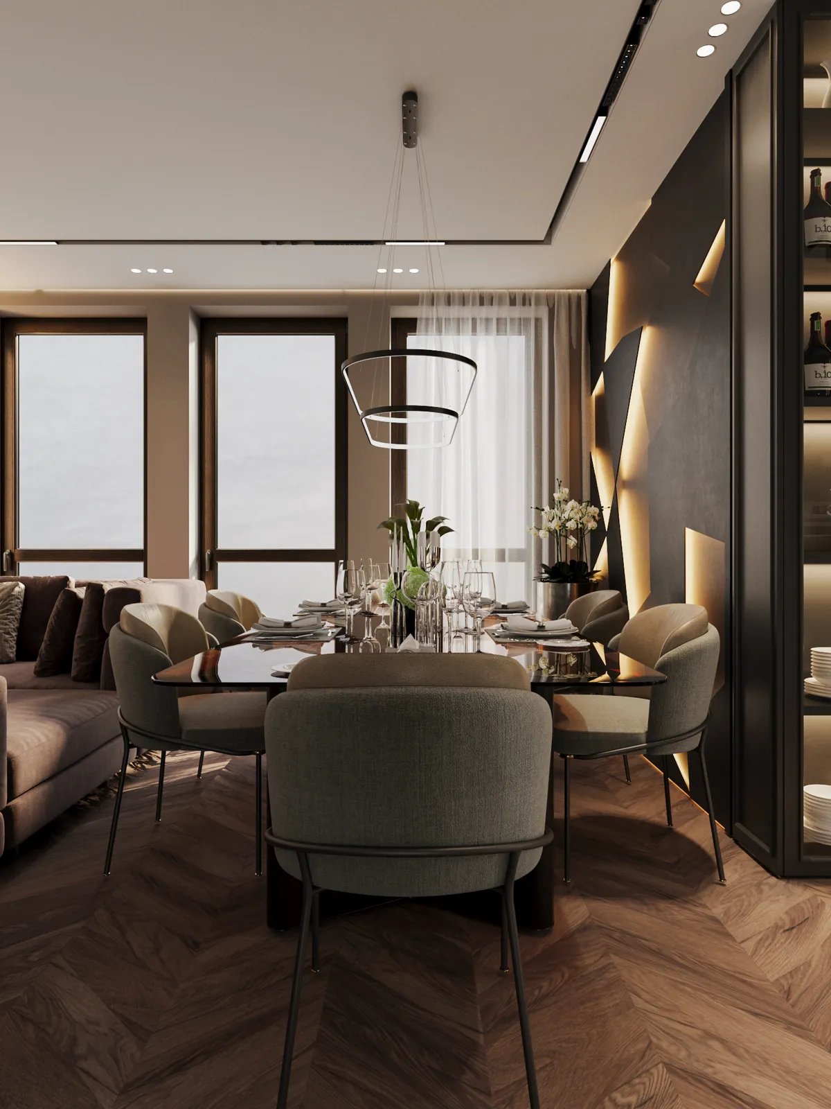 A modern dining area featuring a set table, grey upholstered chairs, chevron wood flooring, and a striking geometric accent wall with integrated lighting.