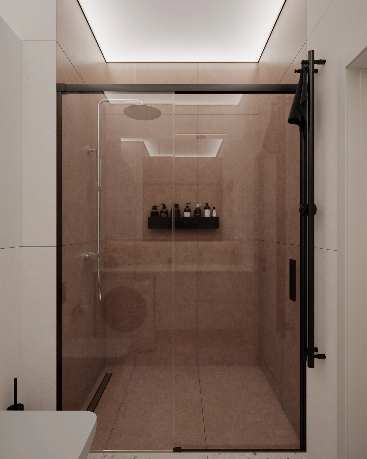 Un duș modern cu cabină din sticlă, cu un design minimalist și nuanțe neutre.