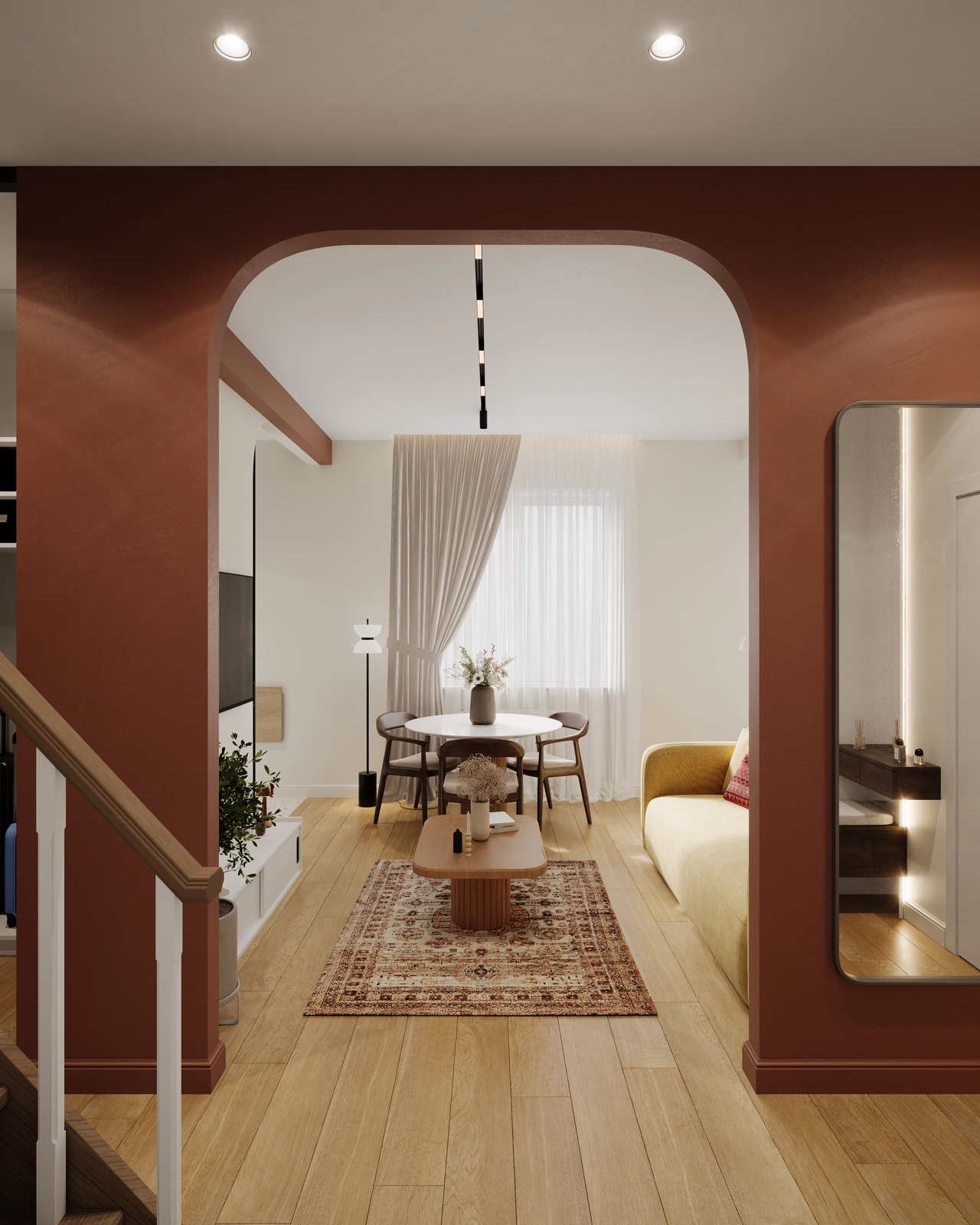 Un living modern, dotat cu o zonă de luat masa cu o masă rotundă și scaune, o zonă de relaxare cu o canapea galbenă și un cadru de ușă arcuit care încadrează priveliștea.