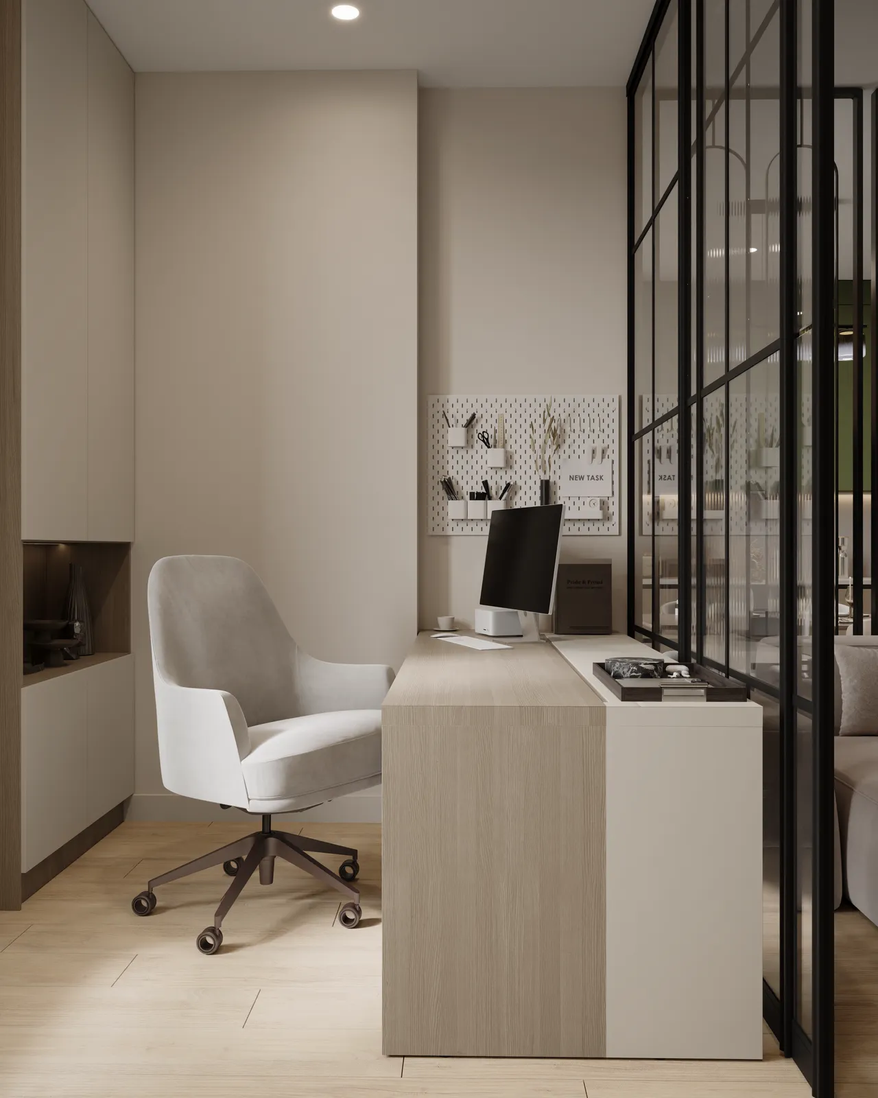 A modern office space featuring a sleek desk, an ergonomic white chair on wheels, and a computer monitor. The room has light-colored walls and wooden flooring, with a glass partition separating the workspace from another area.