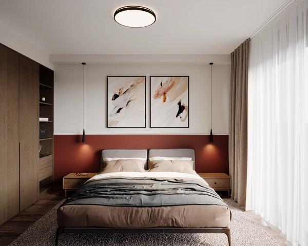 The master bedroom with a terracotta accent wall, a double bed with beige and grey linen, two framed abstract artworks, pendant lamps on either side and floor-length drapes.