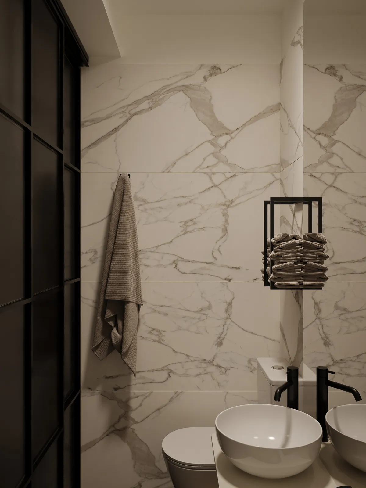 A modern bathroom featuring marble walls, a towel hanging on the wall, a set of neatly stacked towels, and a round sink.